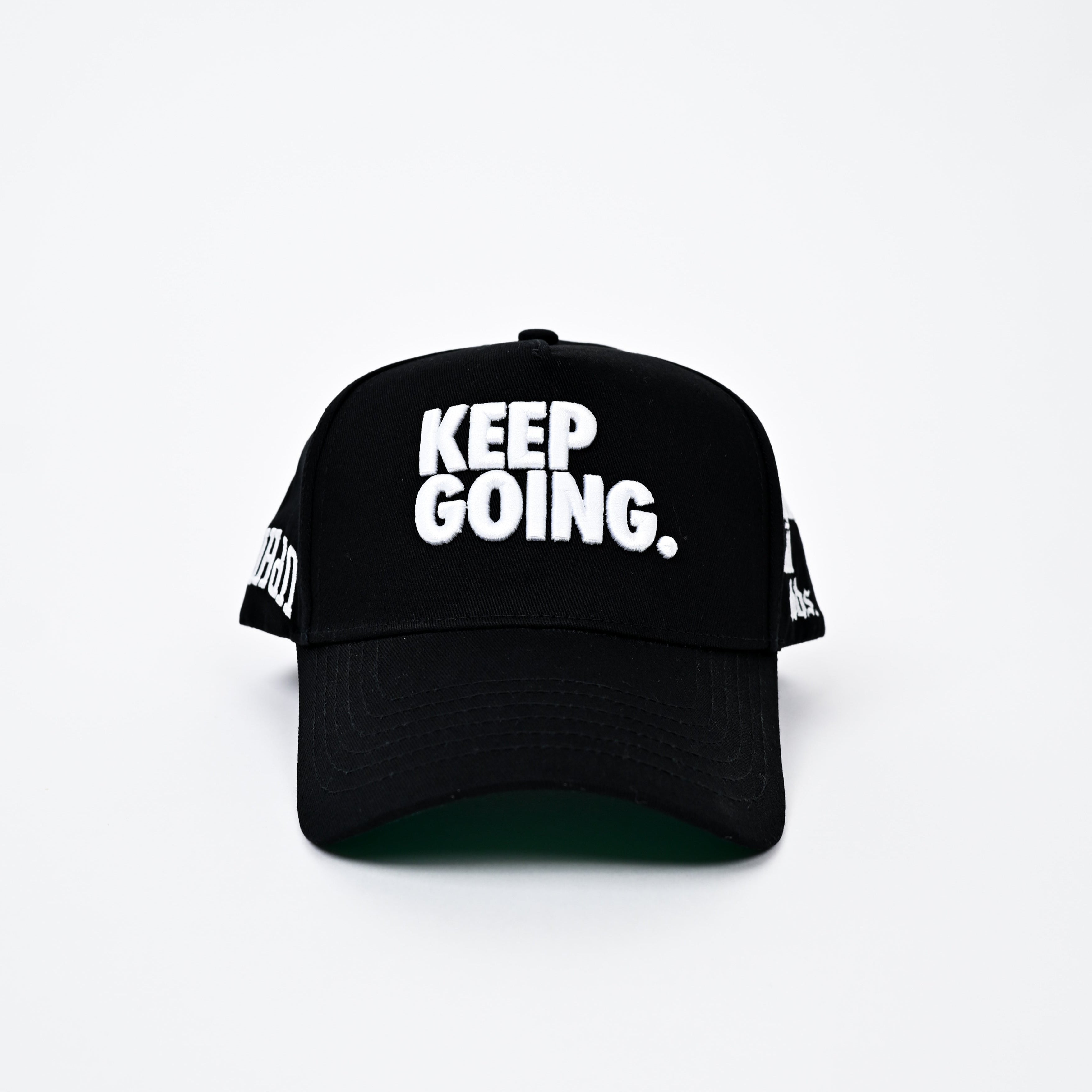 Black cap with 'KEEP GOING.' text on a white background